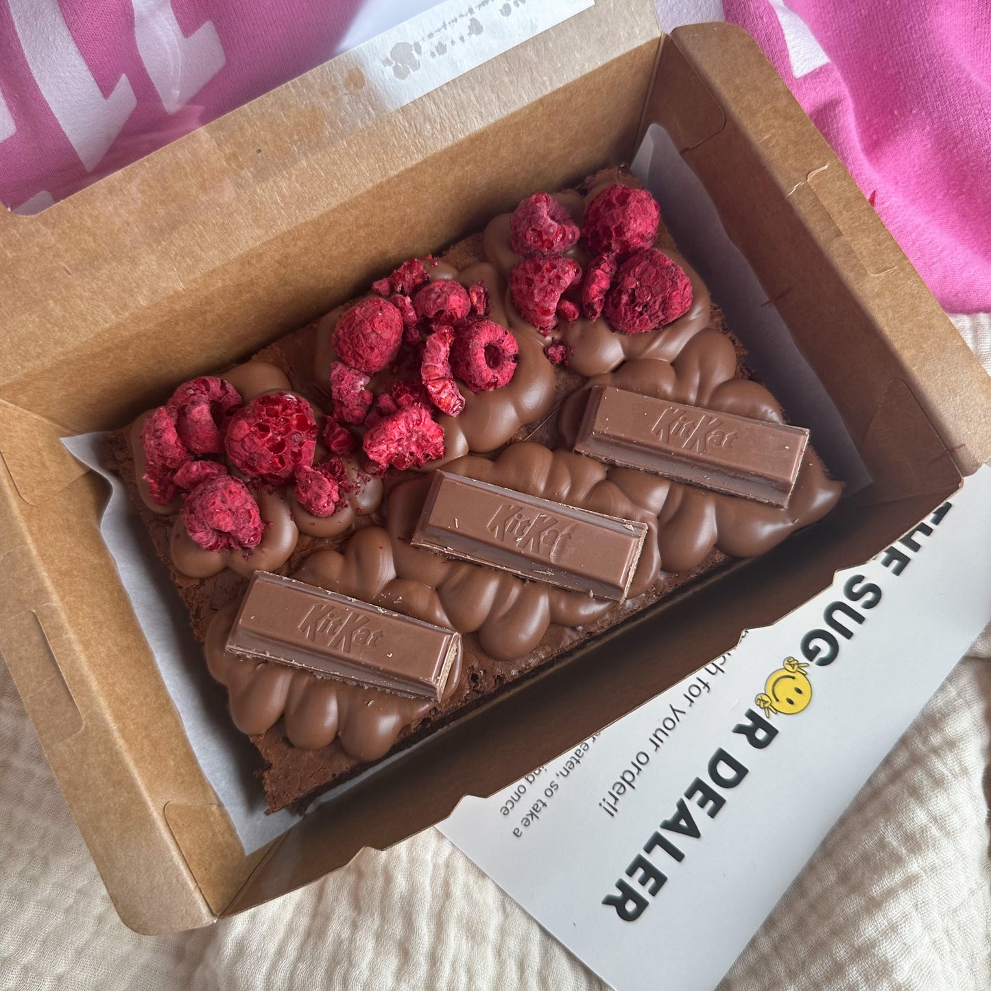 mini chocolate brownie with raspberry and kitkat topping flavours
